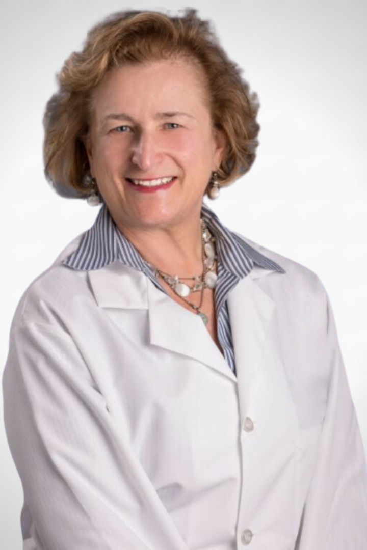 Dr. Andrea Baumann Headshot White Coat